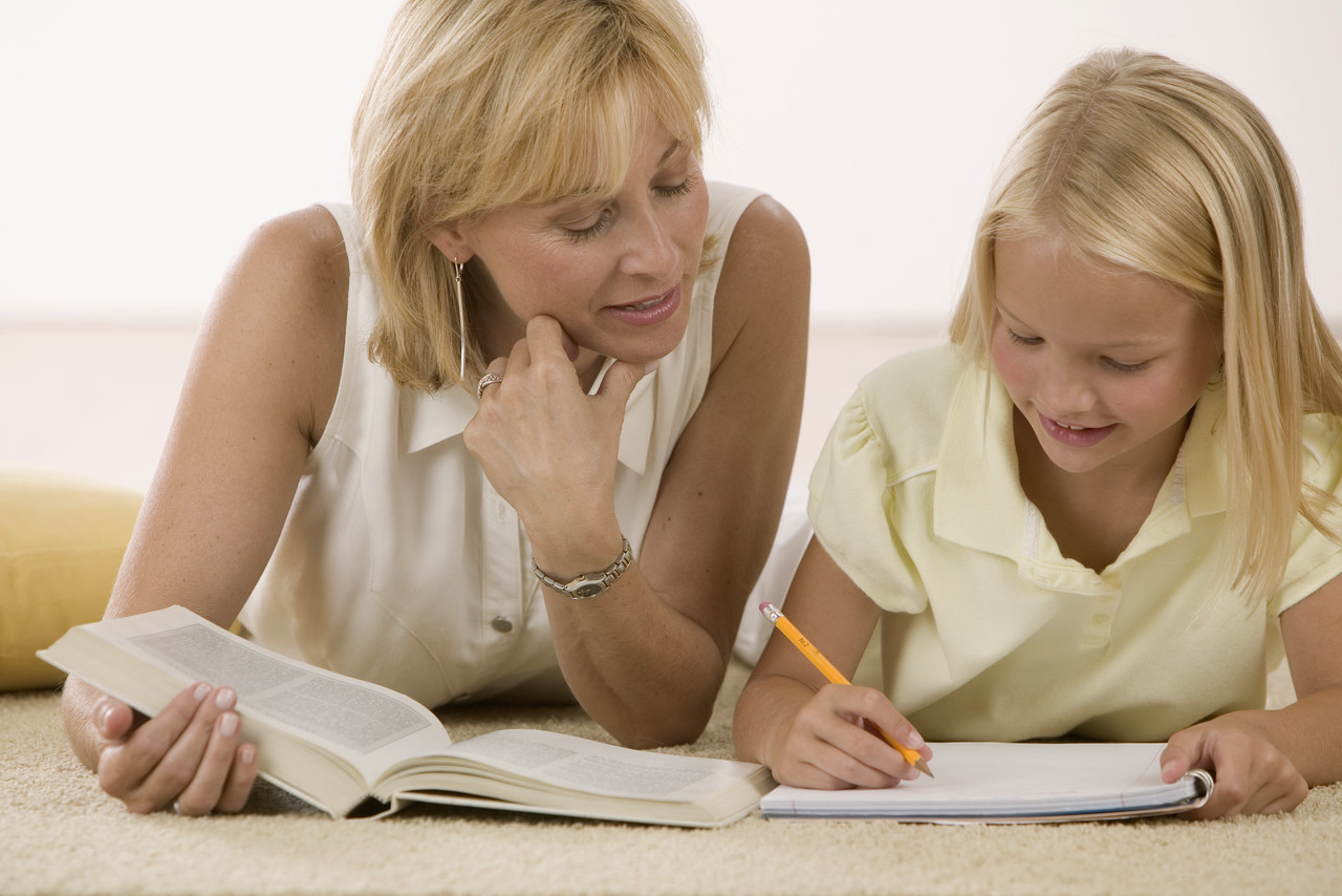 Mother Helping Daughter with Homework